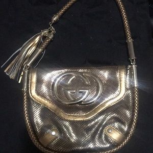 Gold Gucci purse